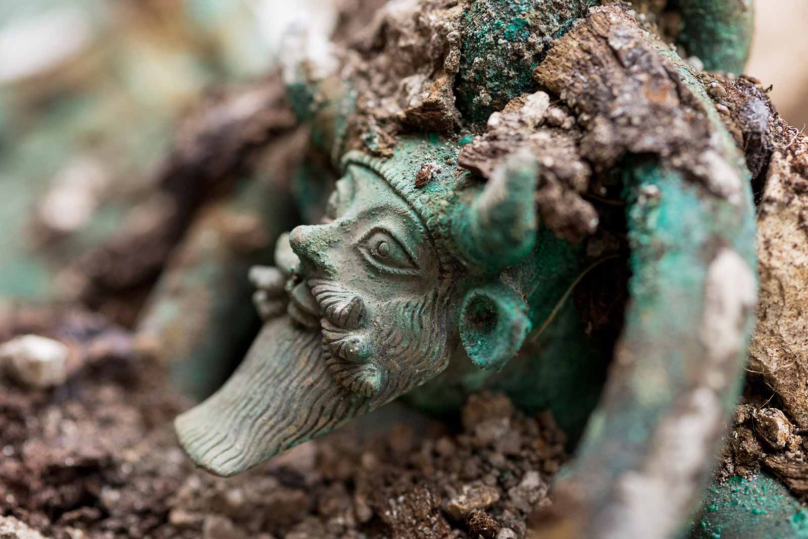  A close-up of a corroded bronze figurine of a Celtic warrior queen unearthed during an archaeological dig in Zurich.